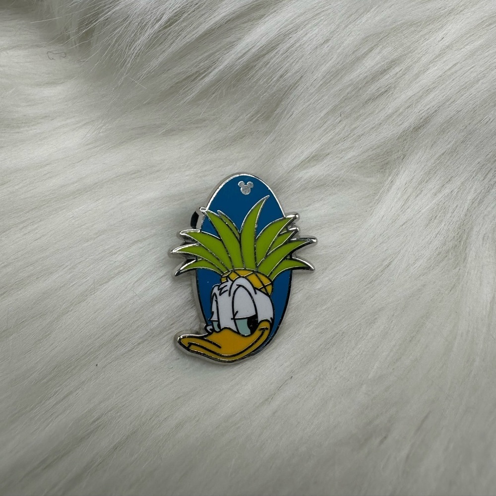 A group of Disney trading pins photographed for a US resale marketplace listing